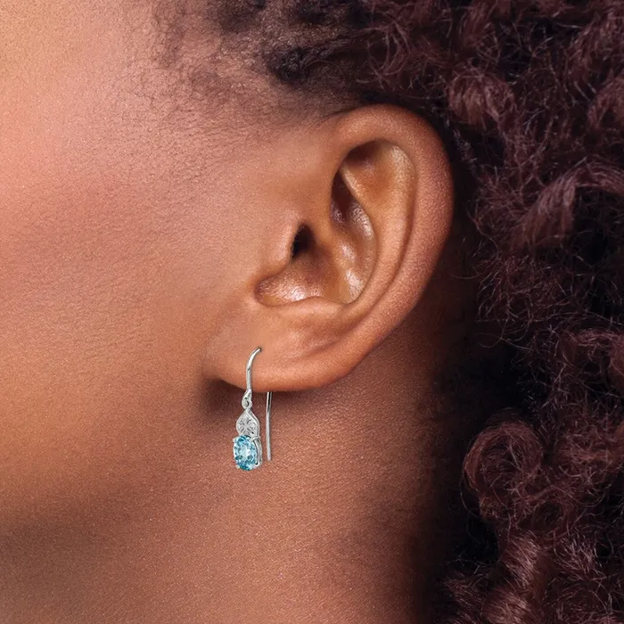 Sterling Silver Rhodium Plated Diamond and Blue Topaz Oval Earrings Goldia Earrings