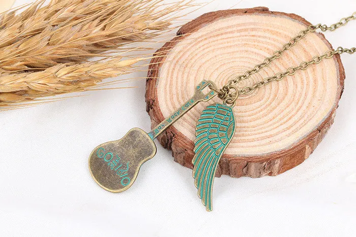 Romantic Green Angel Wing Guitar Unisex Pendant Necklace sparklingselections Necklaces Romantic Green Angel Wing Guitar Unisex Pendant Necklace sparklingselections Necklaces